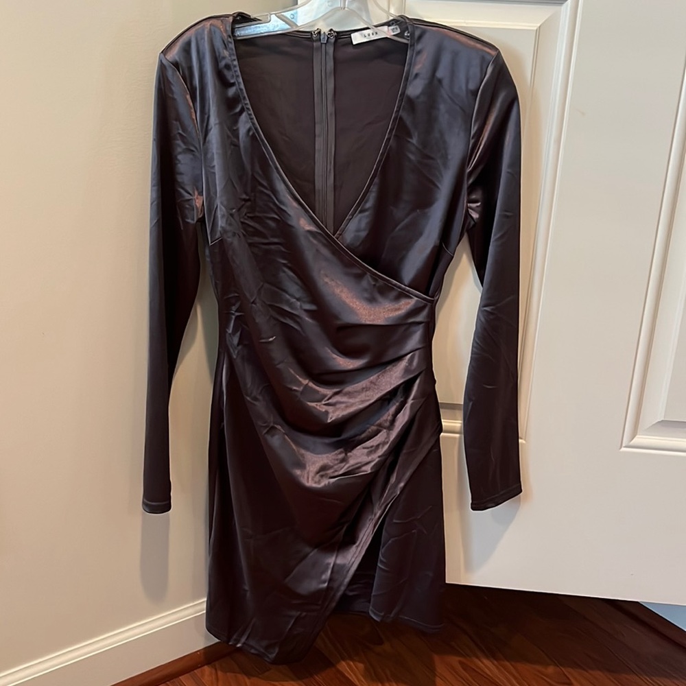 Long sleeve above the knee dress.